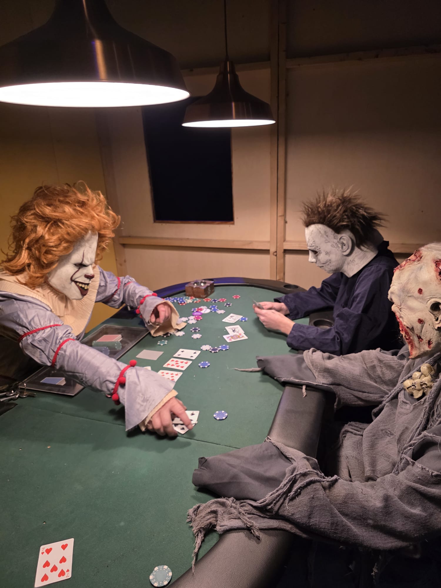 Three Halloween characters in a dark scene
